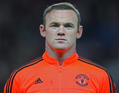 MANCHESTER, ENGLAND - SEPTEMBER 30, 2015: Wayne Rooney looks on