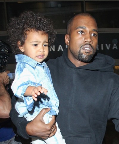 Kim Kardashian, Kanye West and North West Sighted Arriving at LAX on April 16, 2015